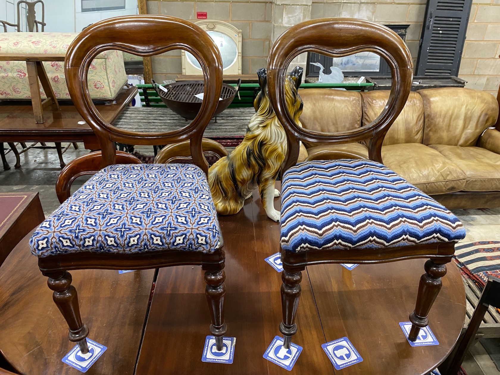 A set of eight Victorian mahogany balloon back dining chairs on turned legs